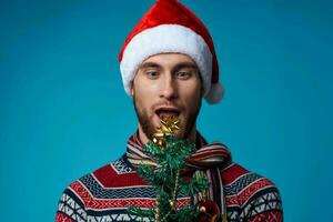 emotional man with a tree in his hands ornaments holiday fun isolated background photo