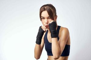 woman sporting boxing bandages rack kickboxing exercise photo