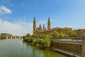 landscape Nuestra Senora del Pilar Cathedral Basilica view from the Ebro River in a spring day photo