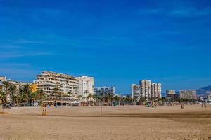 seaside landscape with a beach in the Spanish city of Alicante on a warm sunny day photo