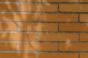 original abstract background from clay brown bricks in closeup photo