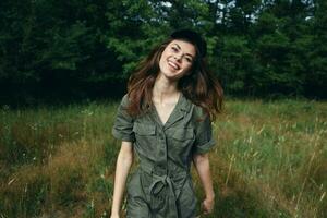 woman in the forest smile fun green jumpsuit travel fresh air summer photo