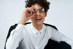 guy curly hair glasses and jacket photography studio model light background Copy Space photo