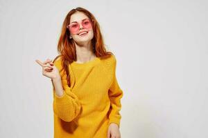 portrait of a woman in a yellow sweater hairstyle light background photo
