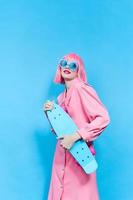 pretty woman in sunglasses wears a pink wig studio model unaltered photo