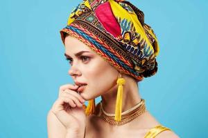 woman in multicolored turban luxury ethnicity blue background photo