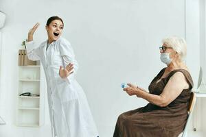 Nurse injecting an elderly woman with a large syringe immunity protection photo