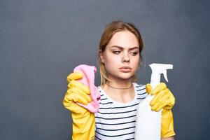 Cleaning lady with detergent rag in hand home care interior service photo