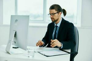 male manager work in front of a computer documents Lifestyle photo