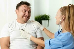 female doctor examining patient hospital health care photo