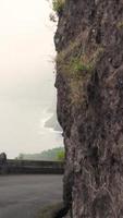 Driving along a mountain road with an ocean view to the left video