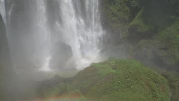 Great water fall on the tropical forest, water stream and splash water when rainy season. The footage is suitable to use for adventure content media, nature and forest footage background. video