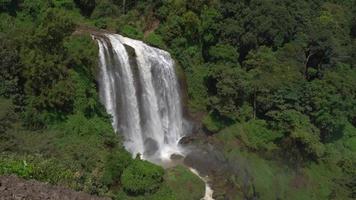 Great water fall on the tropical forest, water stream and splash water when rainy season. The footage is suitable to use for adventure content media, nature and forest footage background. video