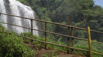 Great water fall on the tropical forest, water stream and splash water when rainy season. The footage is suitable to use for adventure content media, nature and forest footage background. video