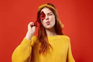 woman with yellow headband red glasses fashion yellow sweater photo