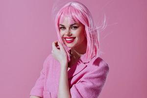 Pretty young female in a pink blazer pink wig cropped view color background unaltered photo