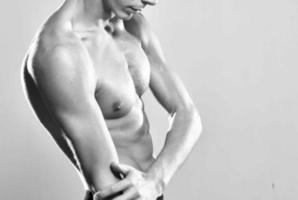 male athlete inflated torso workout posing gym photo