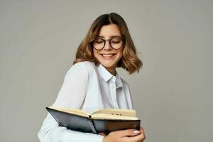 Business woman with notepad in hands professional office official photo