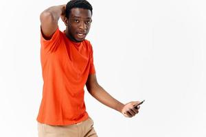 emotional African American with a phone in the hands of technology copy space photo
