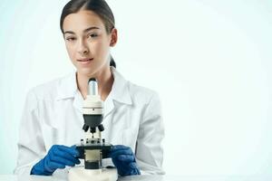 female laboratory assistant science research microscope biotechnology photo