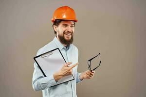 Cheerful male engineer orange hard hat professional construction work photo