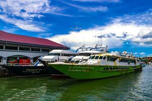 Ratsada Phuket Thailand 2018 Travel Thailand by ferry boat yacht waves through tropical landscape. photo
