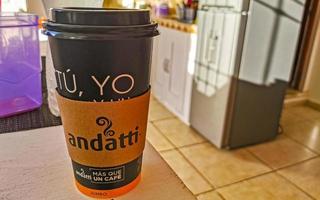 Playa del Carmen Quintana Roo Mexico 2021 Coffee to go cup of black coffee on wooden background. photo