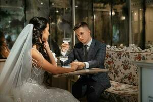 bride and groom inside a cocktail bar photo