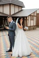 the first meeting of the bride and groom in the courtyard of the hotel photo