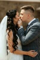 the first meeting of the bride and groom in the courtyard of the hotel photo