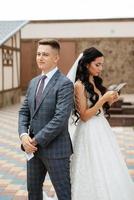 the first meeting of the bride and groom in the courtyard of the hotel photo