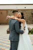 the first meeting of the bride and groom in the courtyard of the hotel photo