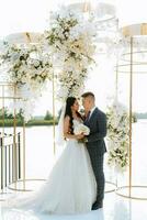 wedding ceremony of the newlyweds on the pier photo