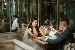 bride and groom inside a cocktail bar photo