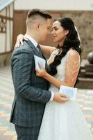 the first meeting of the bride and groom in the courtyard of the hotel photo