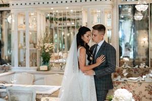 bride and groom inside a cocktail bar photo