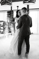 the first dance of the bride and groom inside a restaurant photo