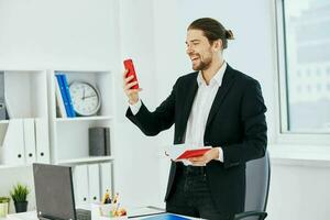 businessmen at the desk documents communication by phone technology photo