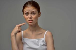 woman in white t-shirt toothache health problems disorder studio treatment photo