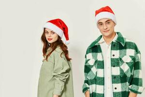 A woman in a cap and a guy in a plaid shirt on a light background photo