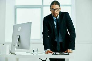 office worker in the office gestures with his hands executive photo