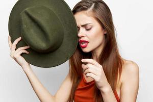 Woman holding hat With an open mouth, look down near face photo