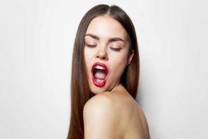 Woman with long Eyes closed, mouth wide open, bare shoulders hairstyle photo