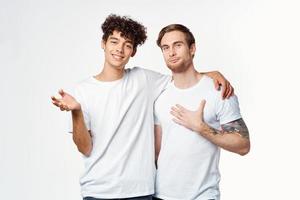 two men are standing next to clean t-shirts emotions photo