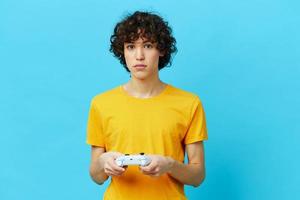 curly guy in plays games gamepad technologies photo