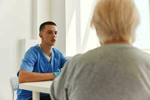 elderly woman talking to the doctor health and medicine photo