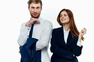 man and woman standing side by side cropped view light background photo