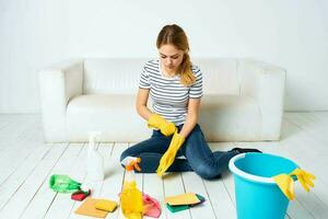 Woman cleaning room cleaning hygiene and interior detergent service photo