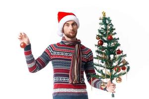 emotional man in a santa hat Christmas decorations holiday New Year studio posing photo