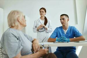 doctor and nurse taking patient in hospital diagnostics service photo